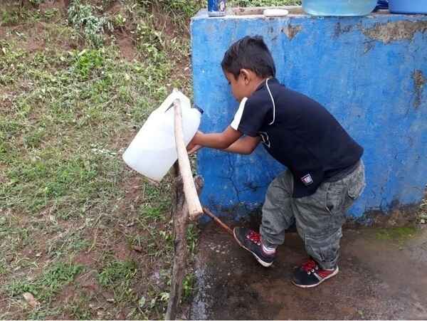 boy gathering clean water
