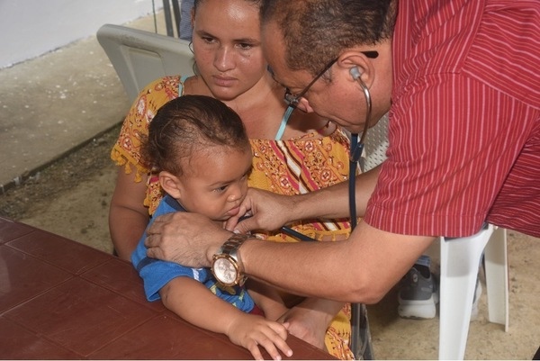 Doctor attending to child