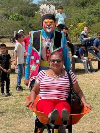 Clown entertaining attendee