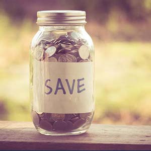Image of a jar of coins with a "SAVE" label on the side