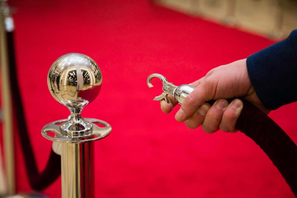 Image of a velvet rope and red carpet